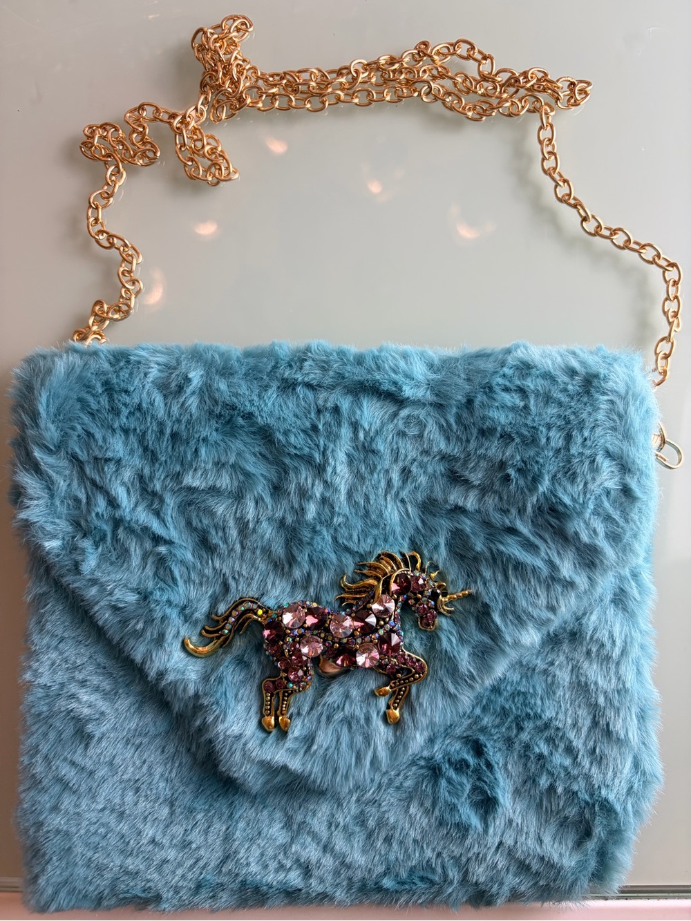 Blue Faux-Fur Crossbody Bag with Unicorn Brooch